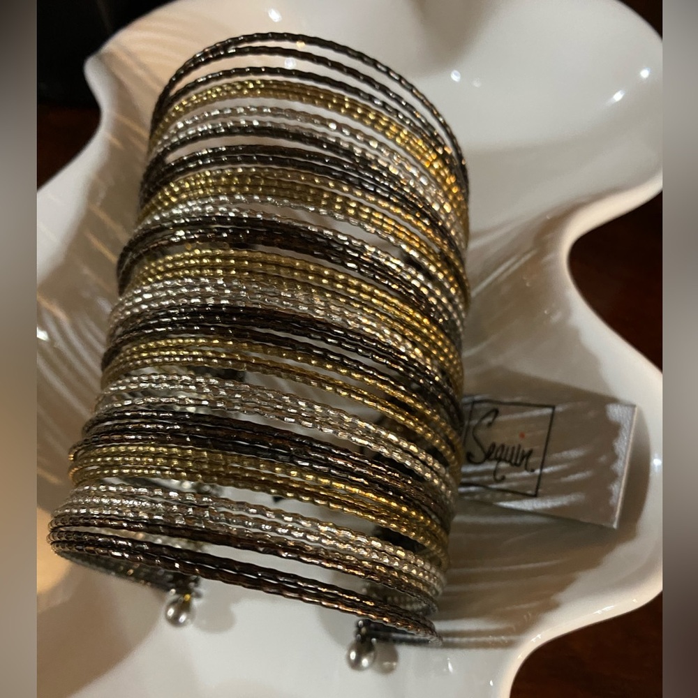 Sequin Brand arm cuff bracelet. 3 1/4” long. Black/silver/gold